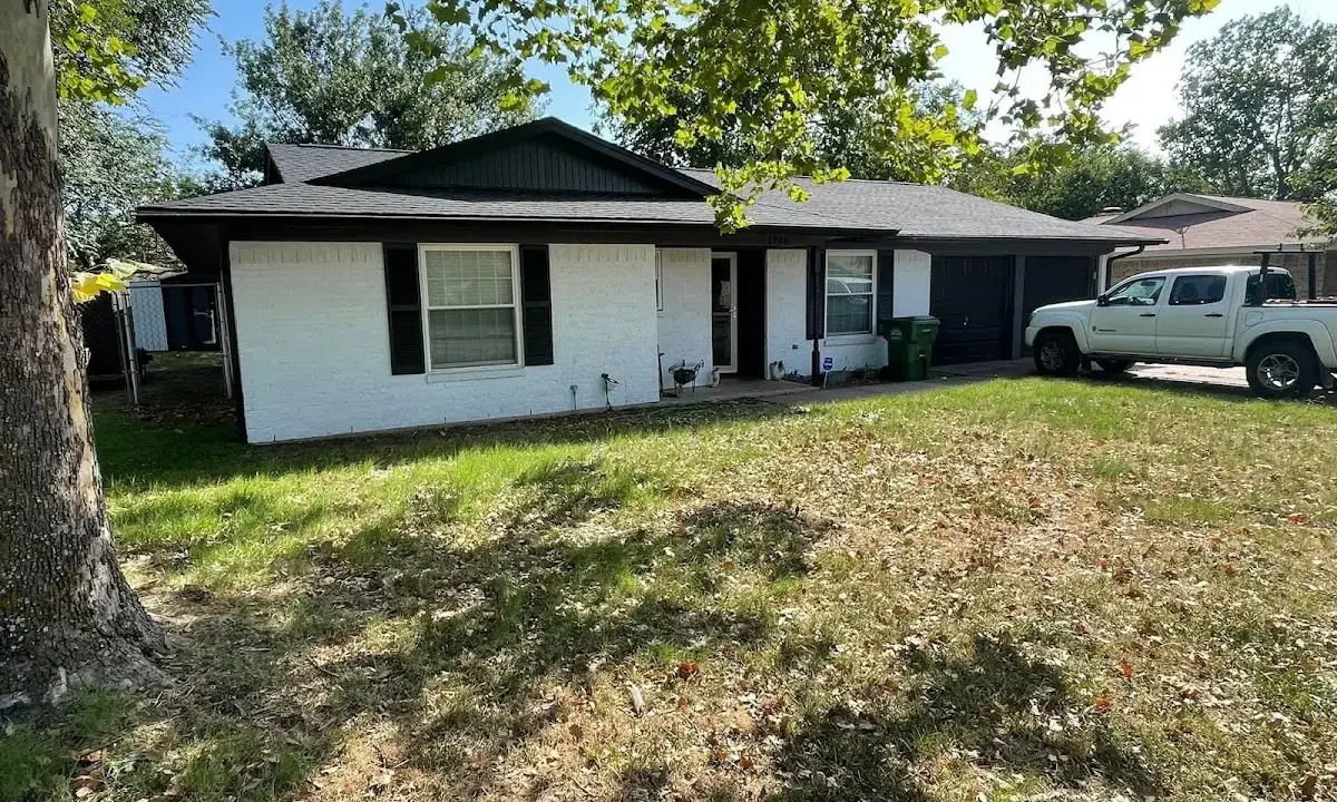 Professional roofing crew working on a residential roof in Niceville